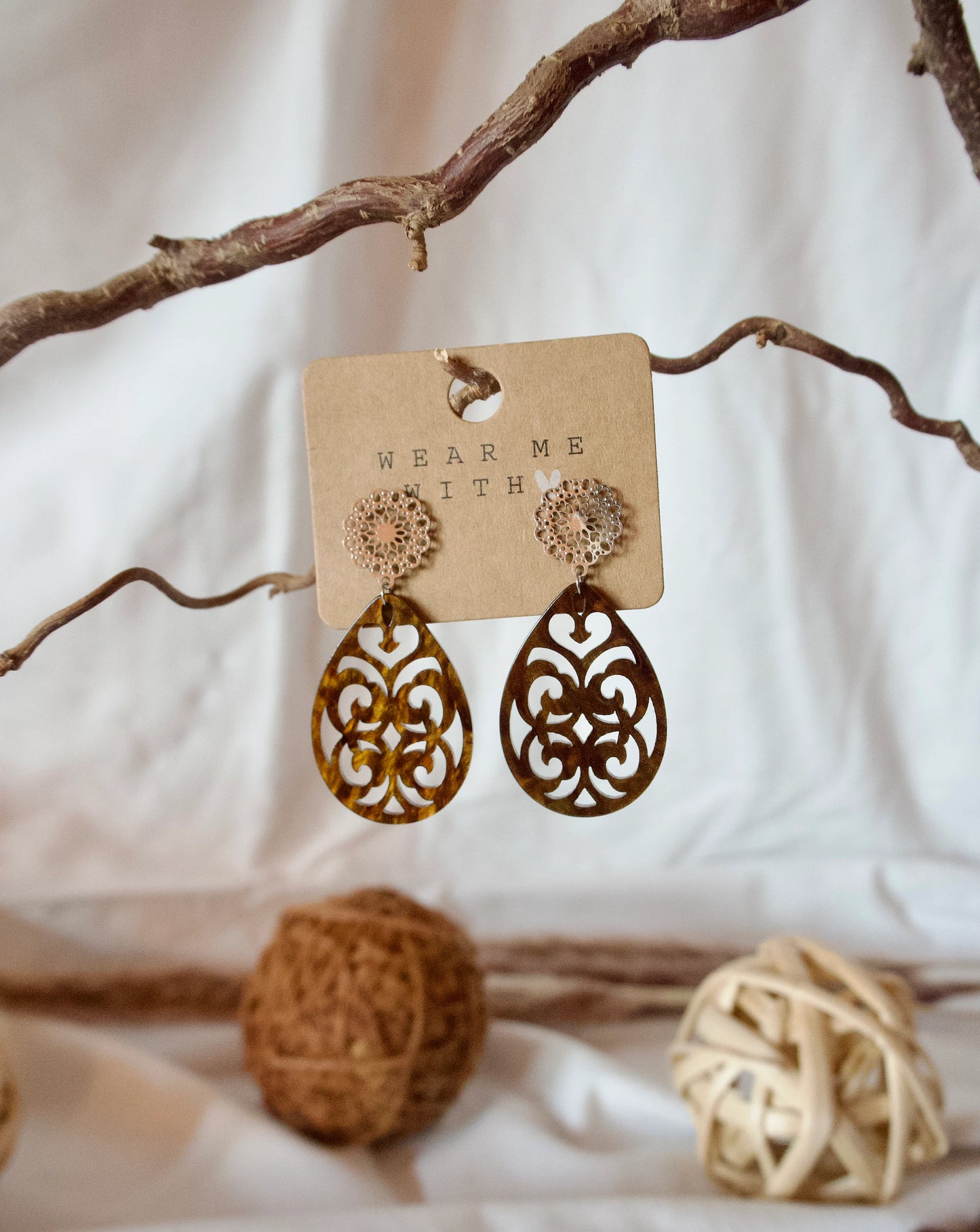 Earrings with resin ornament drops in brown