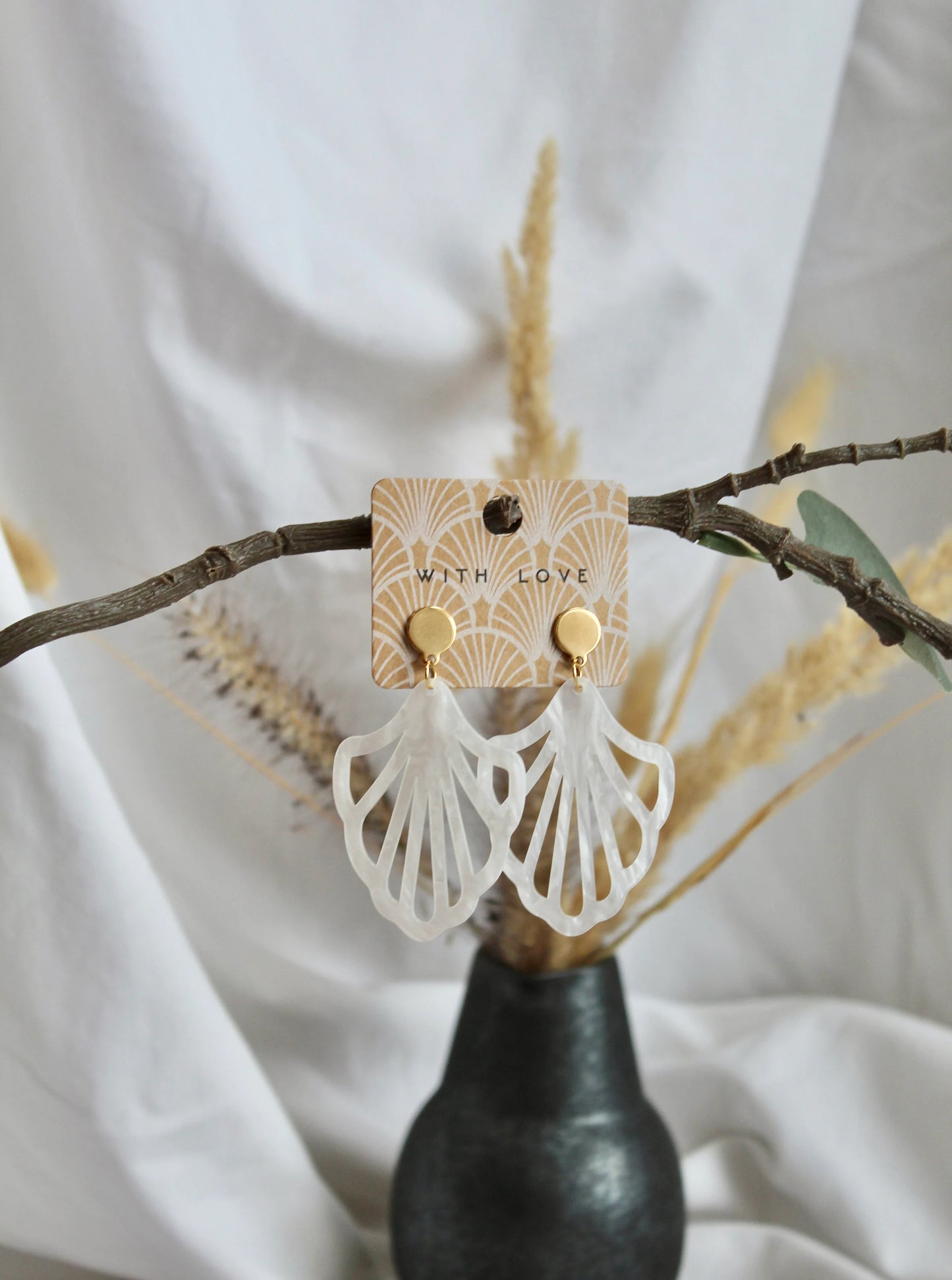 Earrings with resin ornament in white