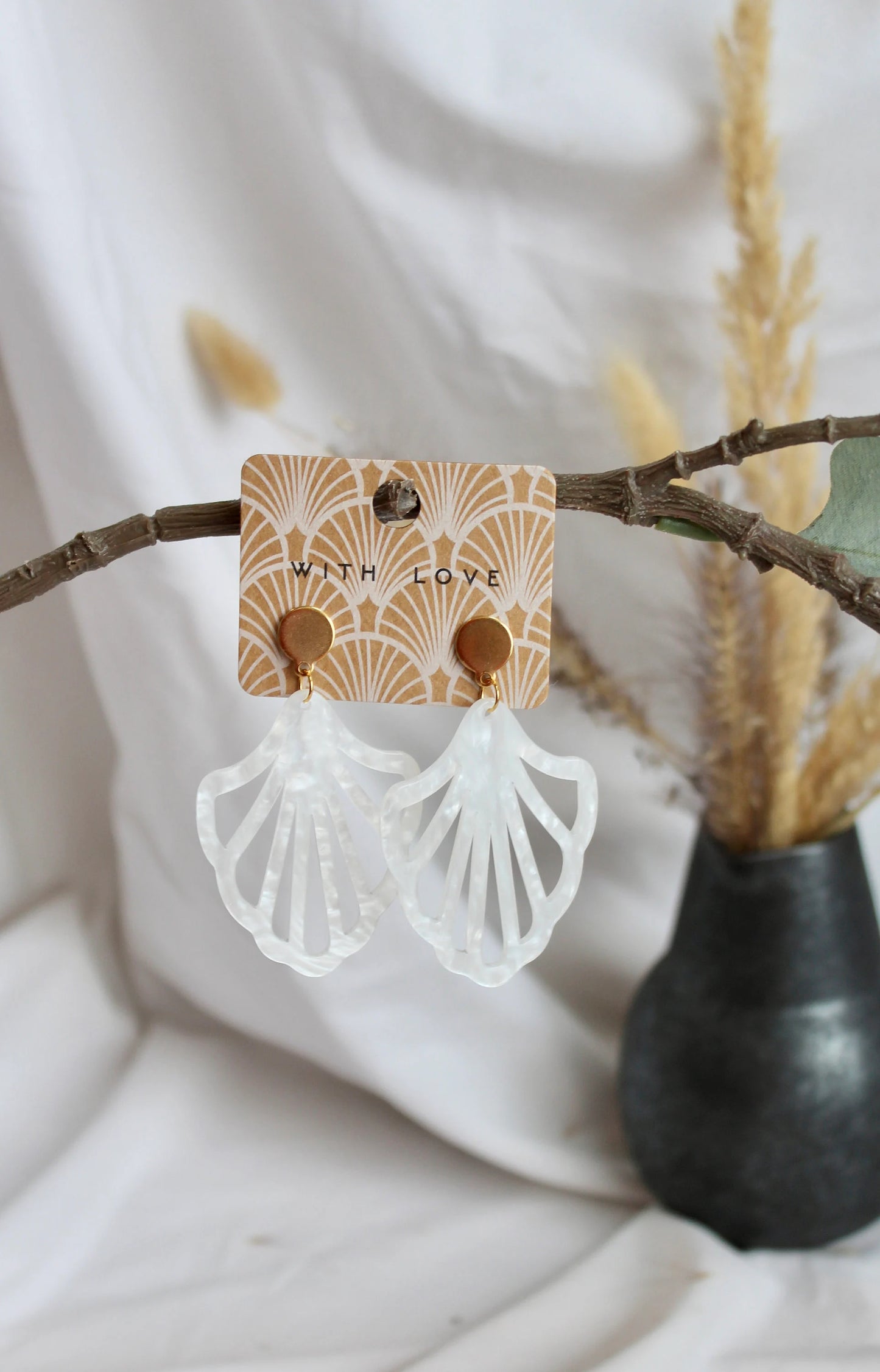 Earrings with resin ornament in white